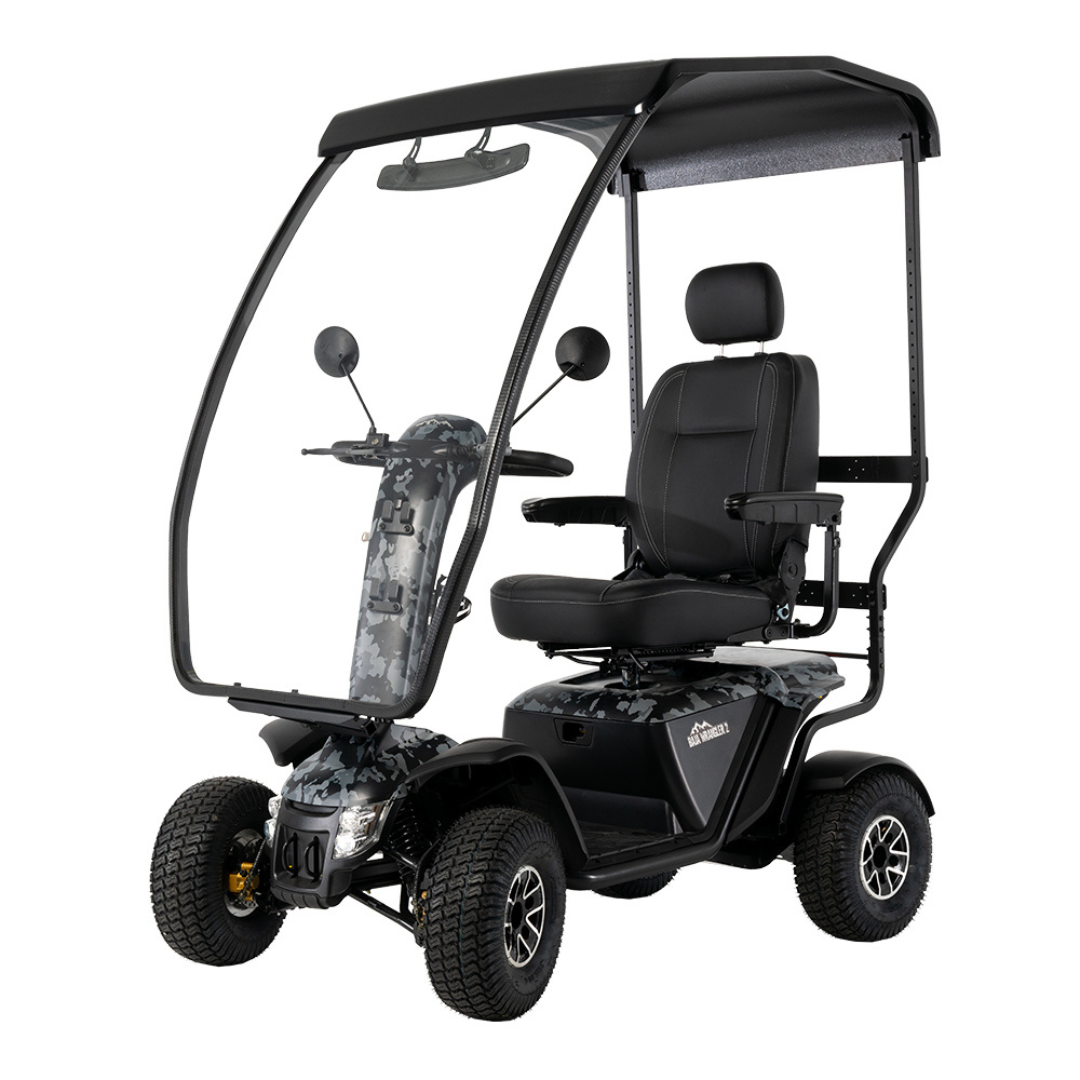 The Pride Baja® Wrangler® 2 Heavy Duty Outdoor Scooter with Canopy is a four-wheeled, single-seat mobility scooter featuring a roof, clear windshield, camouflage front and steering column, large cushioned seat, side mirrors, and outstanding outdoor performance.
